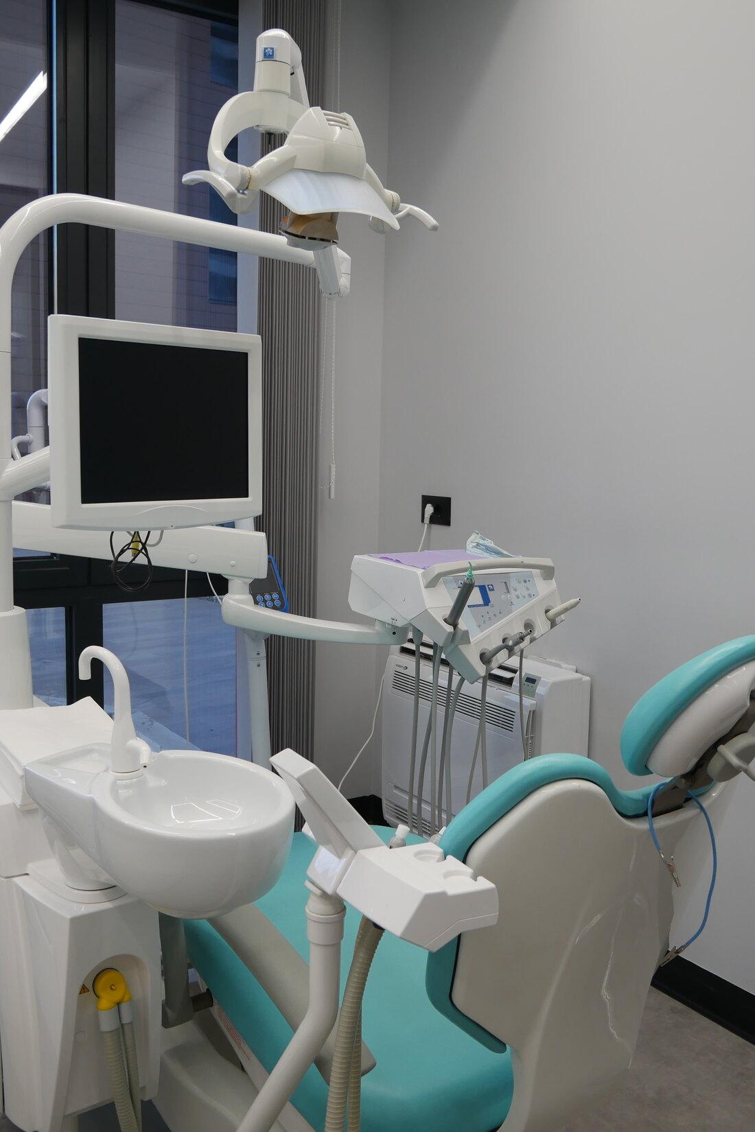Dentist consulting with a patient